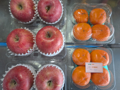 完熟柿と大きいリンゴ